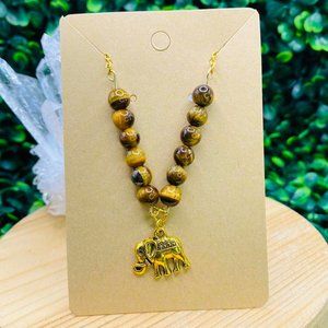 Tigers eye crystal gold necklace with elephant pendant